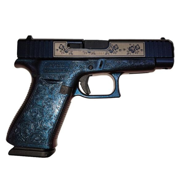 A detailed blue and silver engraved semi-automatic pistol, viewed from the side, showcasing its textured grip and design features.