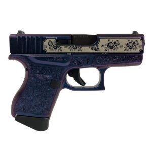 A purple handgun with intricate floral engravings and a silver slide featuring black floral patterns.