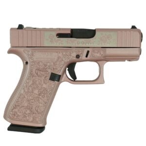 A rose gold, intricately designed semi-automatic handgun angled to the right, showcasing its engraved detailing and features.