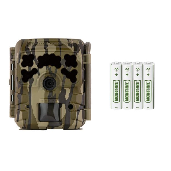 A camouflage wildlife camera with a lens and a compartment for batteries, accompanied by four aa batteries.